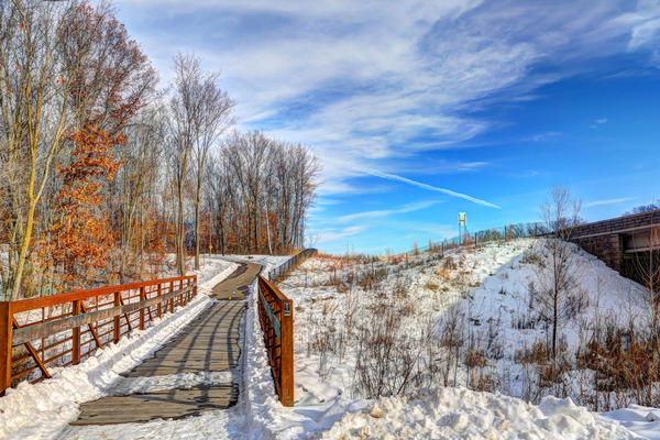 Snow covered park trail area