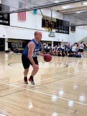 An officer playing basketball