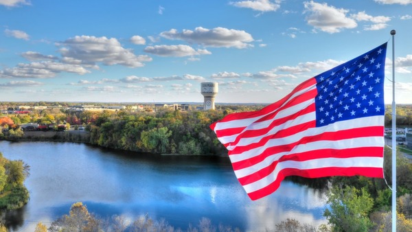 US flag fling over Eden Prairie landscape
