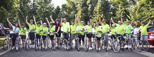 Members of Senior Center biking club waving
