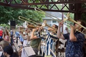 Members of Two Sundays performing trombone