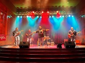 Los Rebeldes band performing on stage