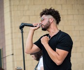 Jordan Johnston singing onstage