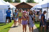 Arts in the Park shoppers walking through pop up tents