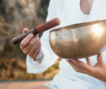 Close-up of a bronze singing bowl during a sound bath session