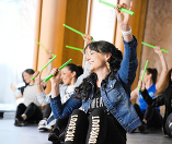 Close up of woman participating in POUND class