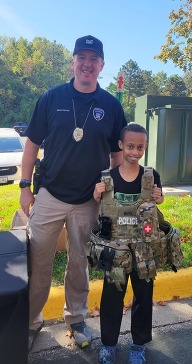 An officer and a child at the 2024 open house