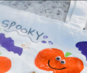 Close-up of painted/stamped trick or treat tote bag