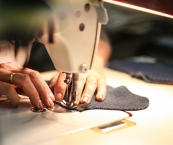 Close-up of someone using a sewing machine