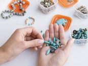 Hand holding turquoise beads