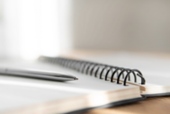 Photo of pen laying on a journal