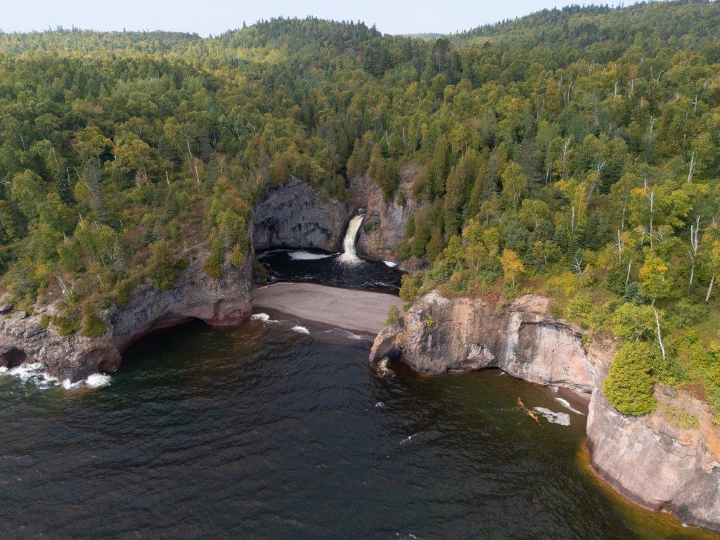 Aerial view of Minnesota North shore of Lake Superior, beautiful shoreline and cliffs with waterfall