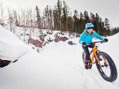 A woman fat biking near Duluth