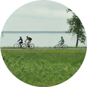 Three riders on the trail around Lake Bemidji