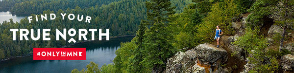 Woman on a hike overlooking a lake, text reading: Find Your True North