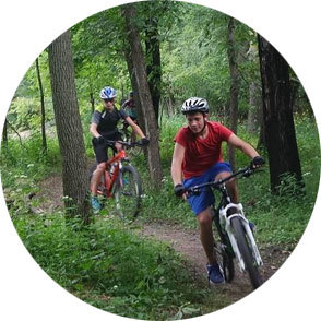 Two high schoolers mountain biking
