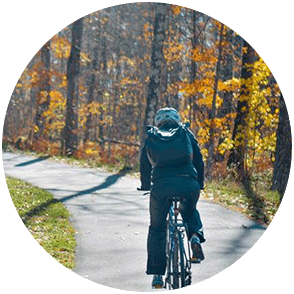 image of a biker surrounded by fall color