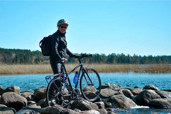 Woman with bicycle at Mississippi Headwaters