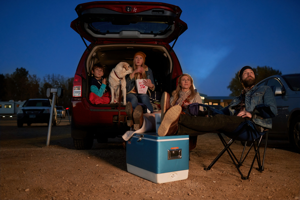 Family at drive-in movie theater