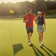 an image of people on a golf coursse