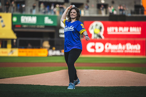 Explore Minnesota Director Lauren Bennett McGinty throws out the first pitch at the St. Paul Saints Game - CHS Field, St. Paul