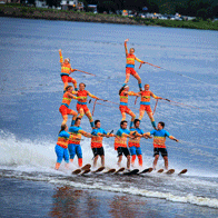 an image of people performing on waterskis