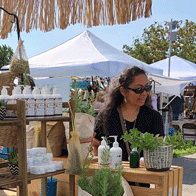 an image of a woman shopping at a vendor booth