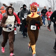 an image of people in customes running a race