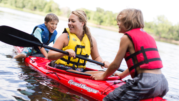 an image of a family in a kayak