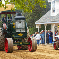 an image of an antique tractor in a parade