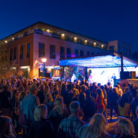 an image of a band playing on an outdoor stage