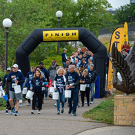 an image of walkers crossing a finish line