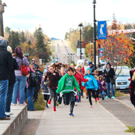 an image of kids and characters in a Moose Madness fun run
