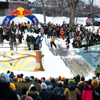 an image of a large crowd in winter outside watching a snowboarder in a competition