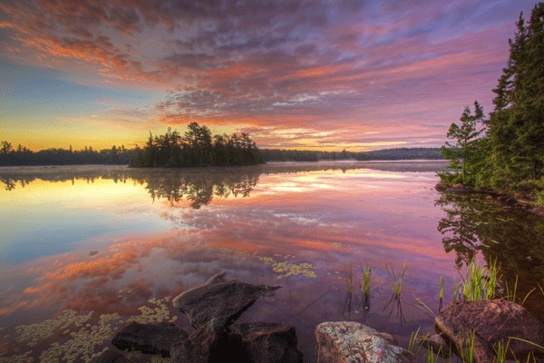 an image of a sunrise over Grace Lake in the Boundary Waters Canoe Area Wilderness by Gary Hamer
