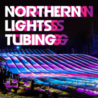 an image of a birghtly lit tubing hill at Buck Hill at night