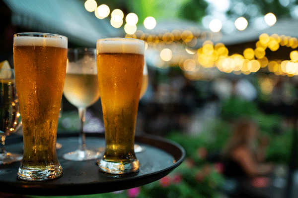 an image of two beers on a tray outside at W.A. Frost in St. Paul