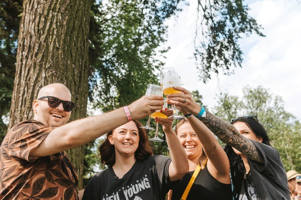 an image of friends raising a glass at Rare Beer Picnic in Moorhead
