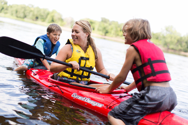 an image of a mom and kids kayaking on the Mississippi River