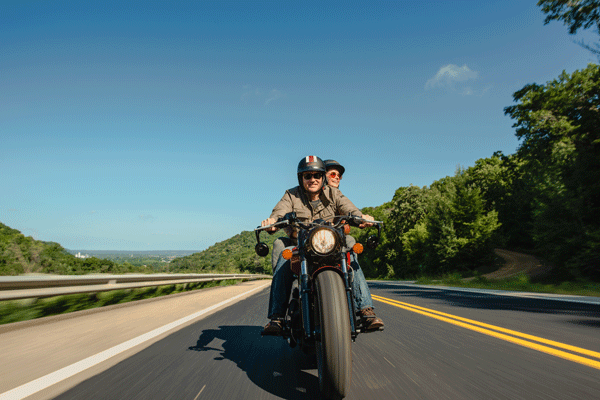 an image of a couple exploring the hills and river bluffs around Red Wing by motorcycle