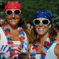 an image of two women with beer after finishing the Firecracker Run