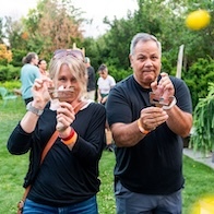 an image of people holding cardboard slingshots