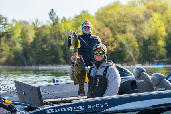 Fishers showing off their bass catches