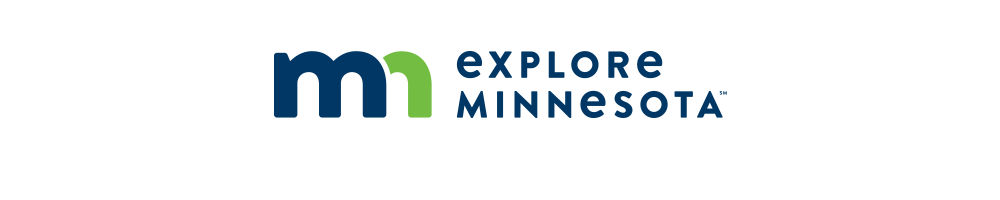 explore minnesota main logo: a navy "m", a lime green "n" on the left. "explore minnesota" in navy to the right of the brand mark.