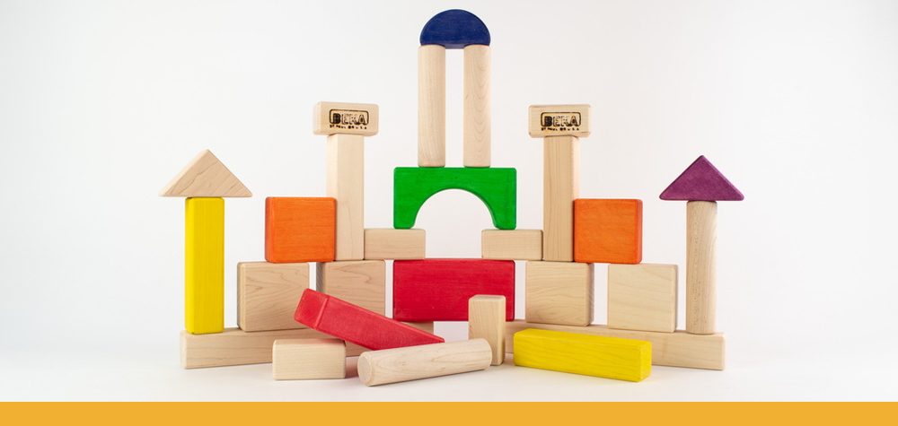 rainbow wooden blocks stacked like a castle and moat