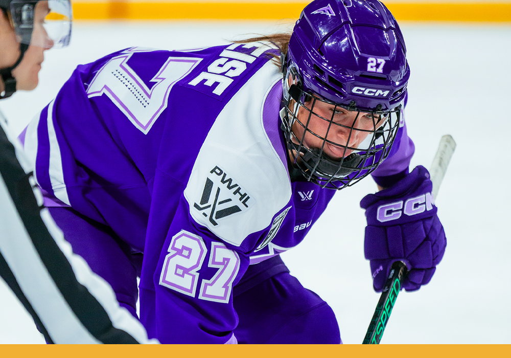 Taylor in the Frost's purple, lavender and white uniform, ready for the face off during a game.