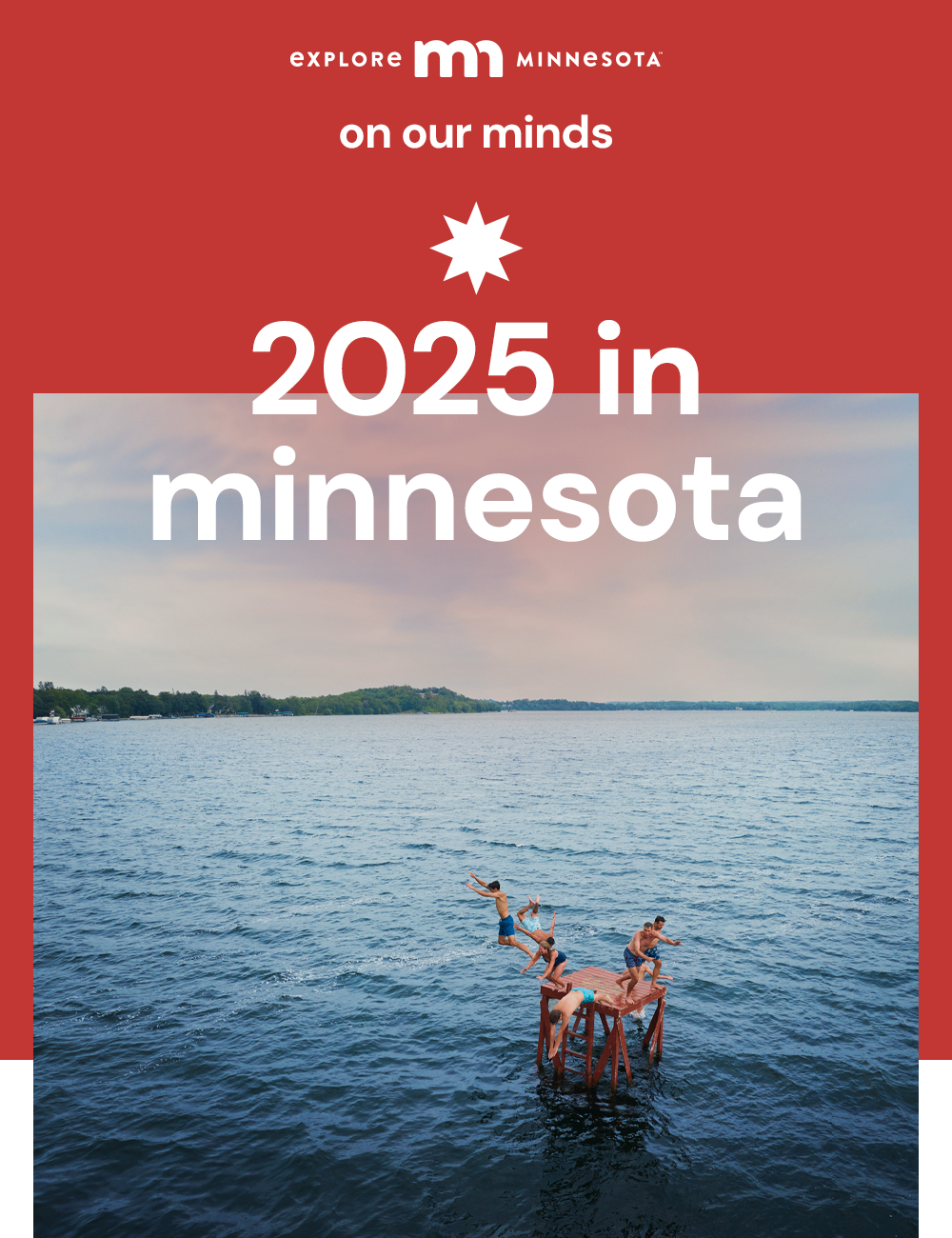 explore minnesota | on our minds | 2025 in minnesota | family in the summer jumping off a floating raft into a beautiful blue lake