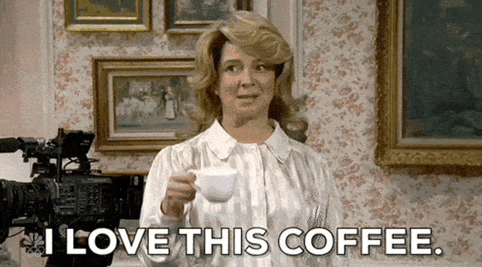 a gif from SNL's Coffee Commercial sketch | woman dramatically says with head nods at each word, "I. LOVE. THIS. COFFEE." and takes a sip after