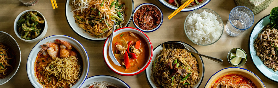 top down view of bowls with noodles, rice, peppers, and shrimp