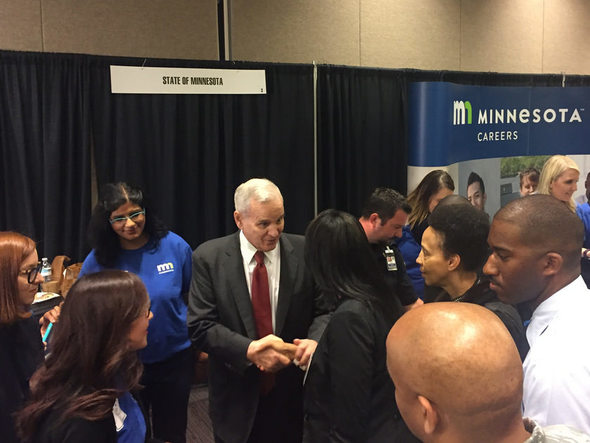 Governor Dayton meets with Minnesotans at the People of Color Career Fair in April, 2017.